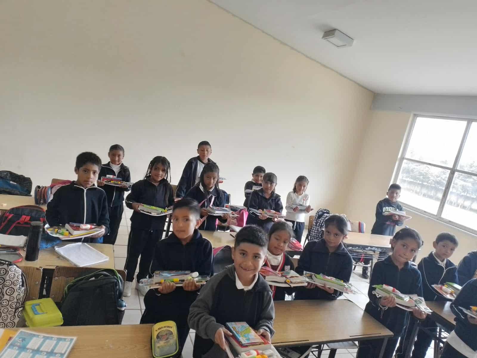 Students and teacher working together at La Salud Elementary